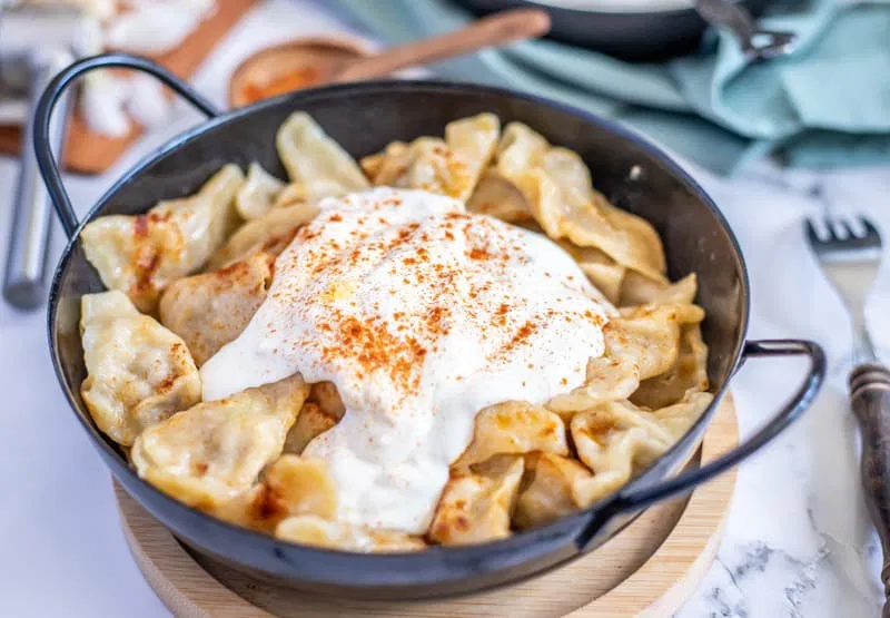 Bosnian klepe dumplings — handmade meat-filled dumplings served with garlic yogurt sauce