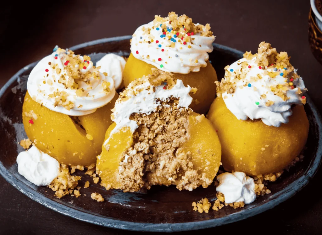Tufahija — Bosnian walnut-stuffed poached apples with sweet syrup and cream topping